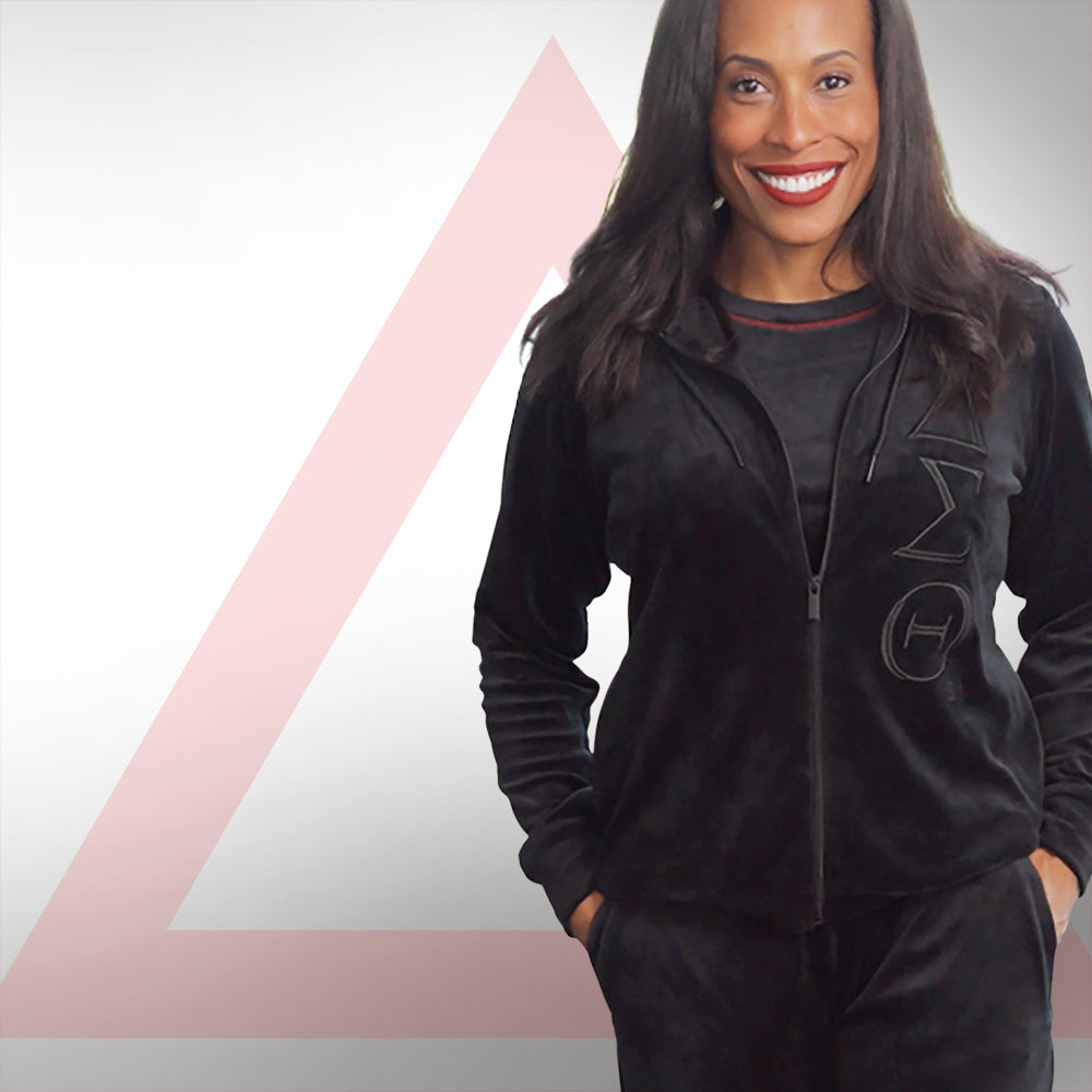 A soror in the black Phantom velour set with crimson Δ trim